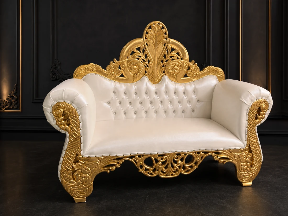 Ivory and gold loveseat for a wedding